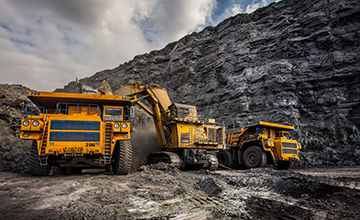 Coal production at one of the open fields in the south of Siberia. Dumpers "BelAZ". September 2015.